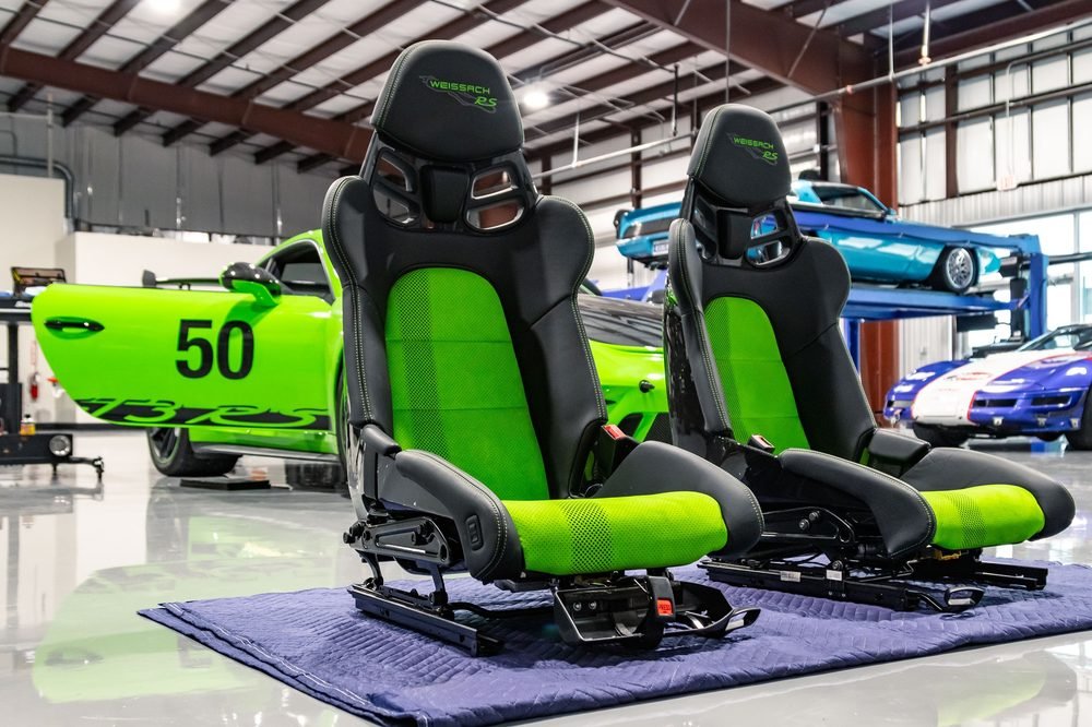Two green and black Weissach RS racing seats