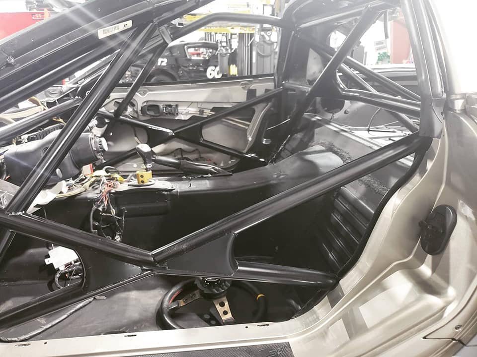 Roll cage installed in a race car interior