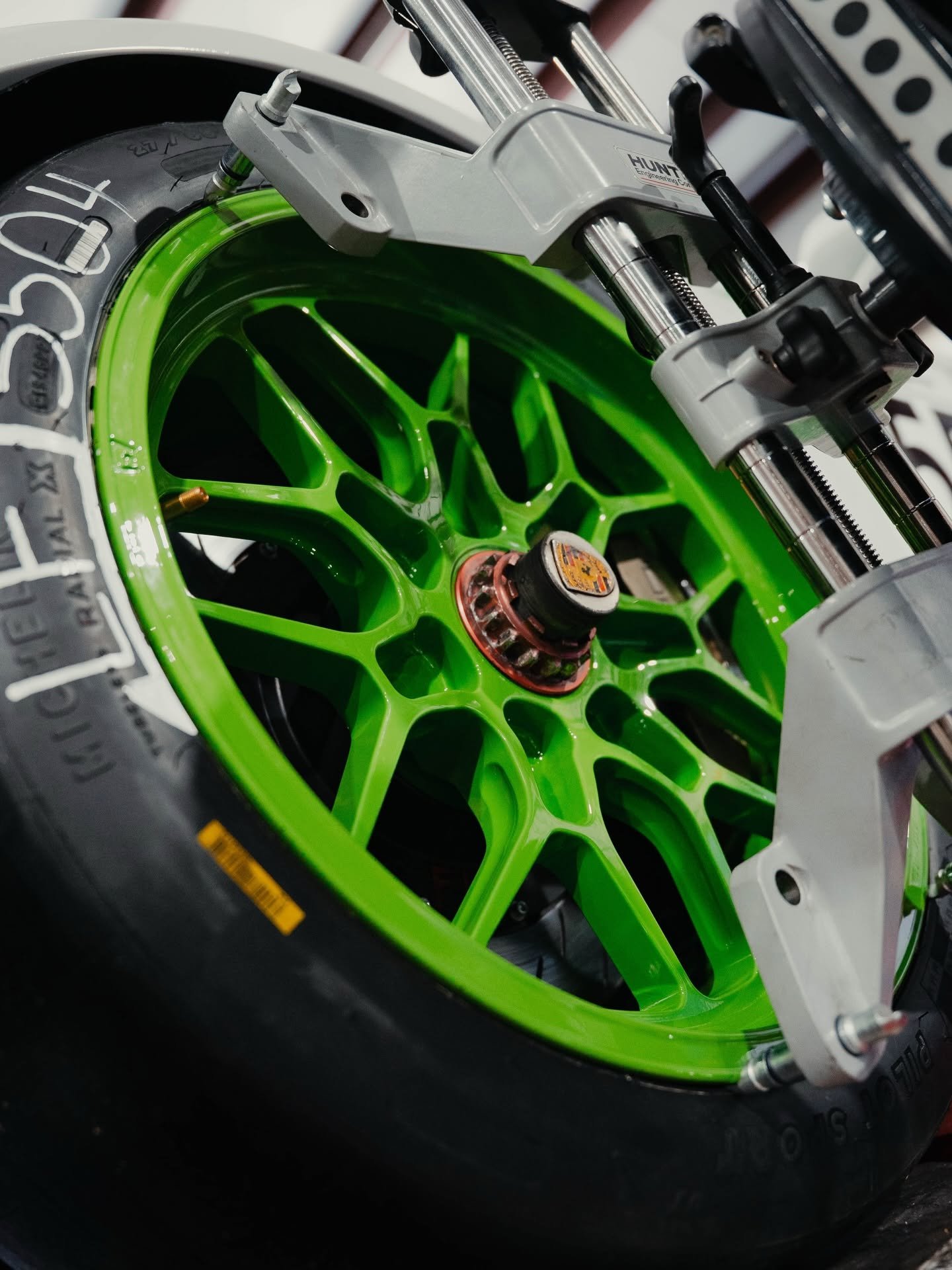 Close-up of a green wheel on the Hunter alignment machine